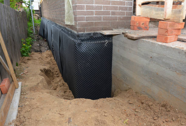 SJ Waterproofing Pros technician performing targeted Waterproofing assessment in Hydes, MD